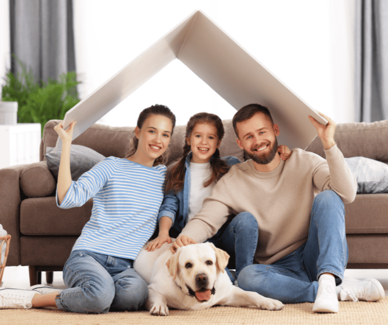 a family and their pet in their new home