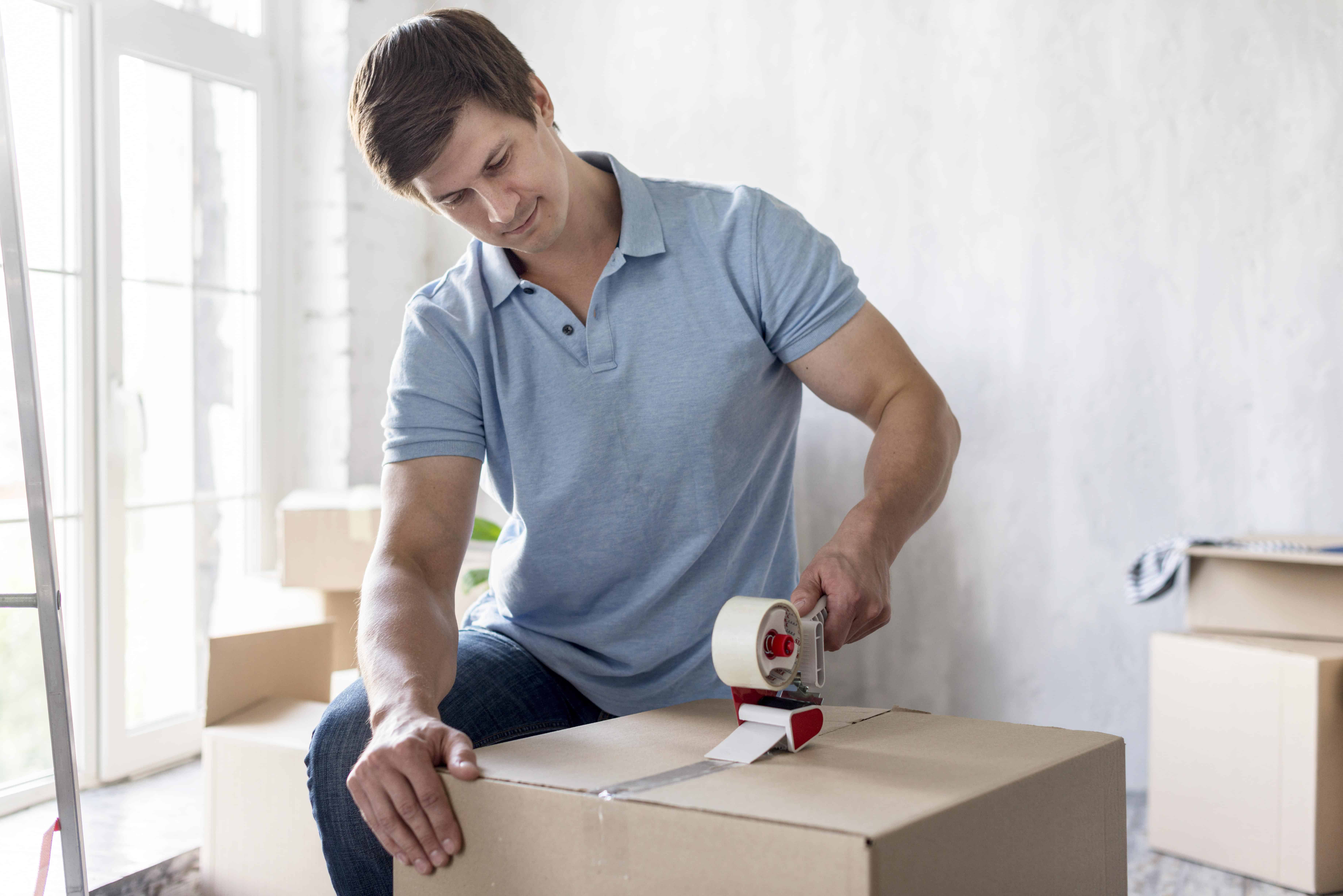 man packing moving items