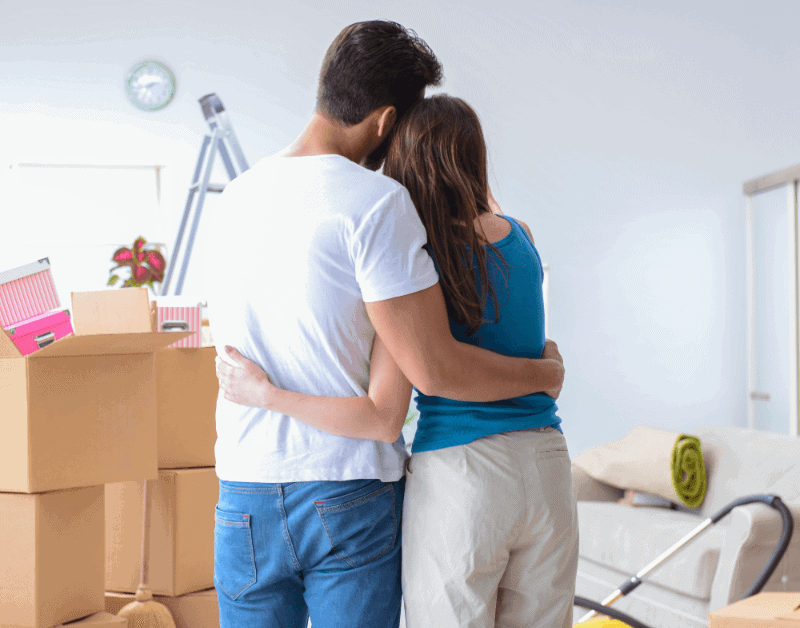 a couple hugging after moving