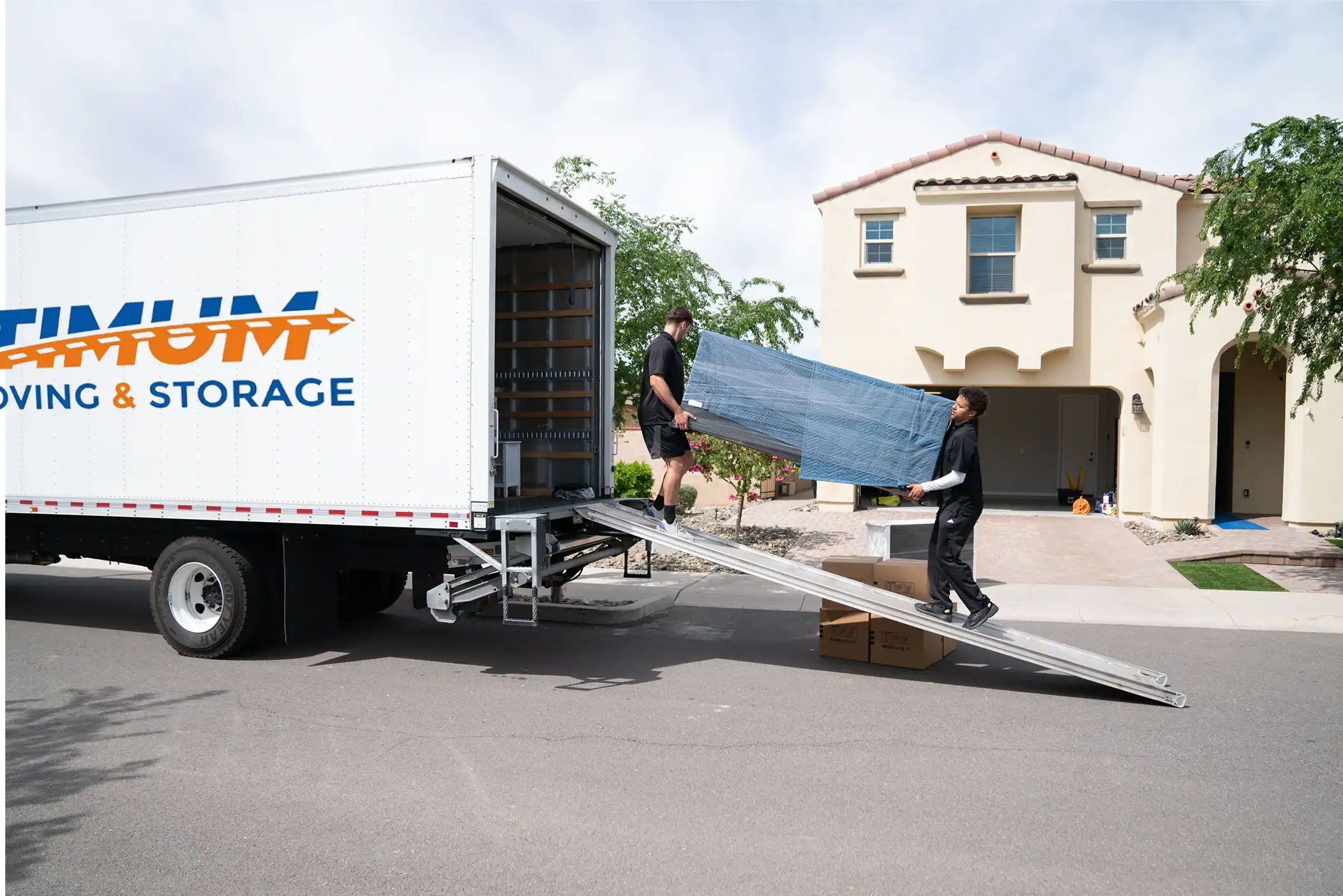 Moving furniture into a truck for home relocation.