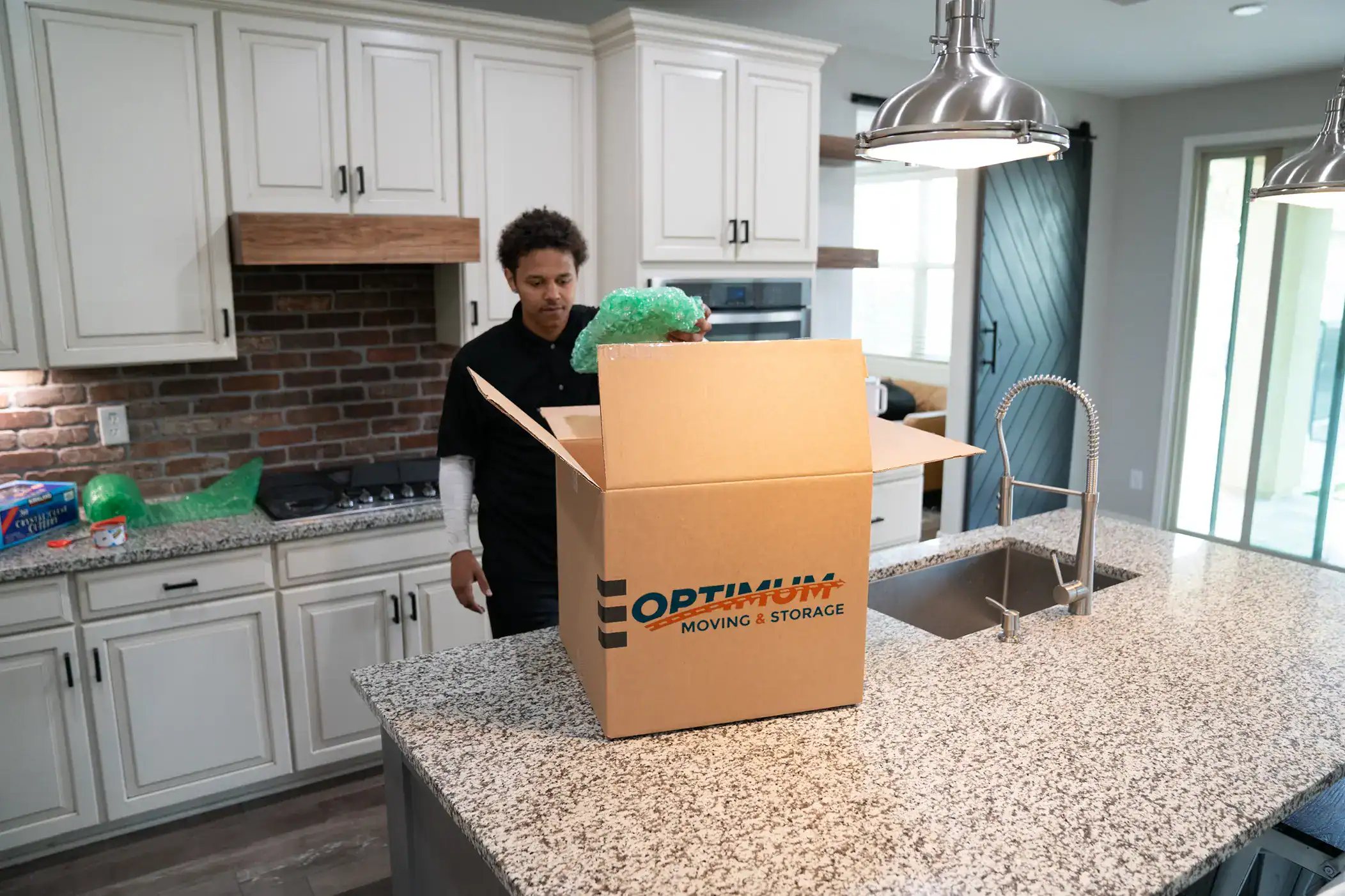 Mover packing a box.