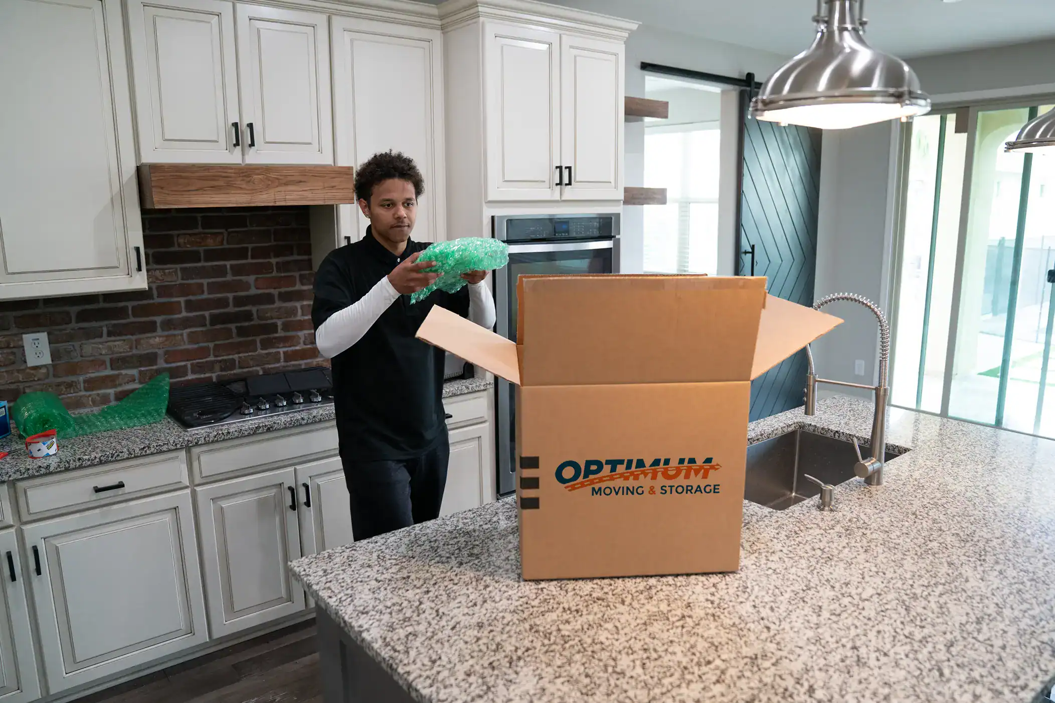 Mover packing a box.